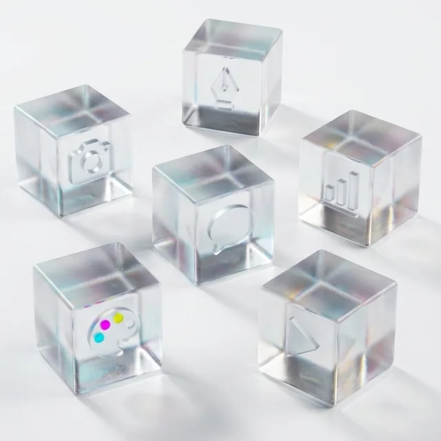 Six separate glass cubes, each holding a different creative tool icon