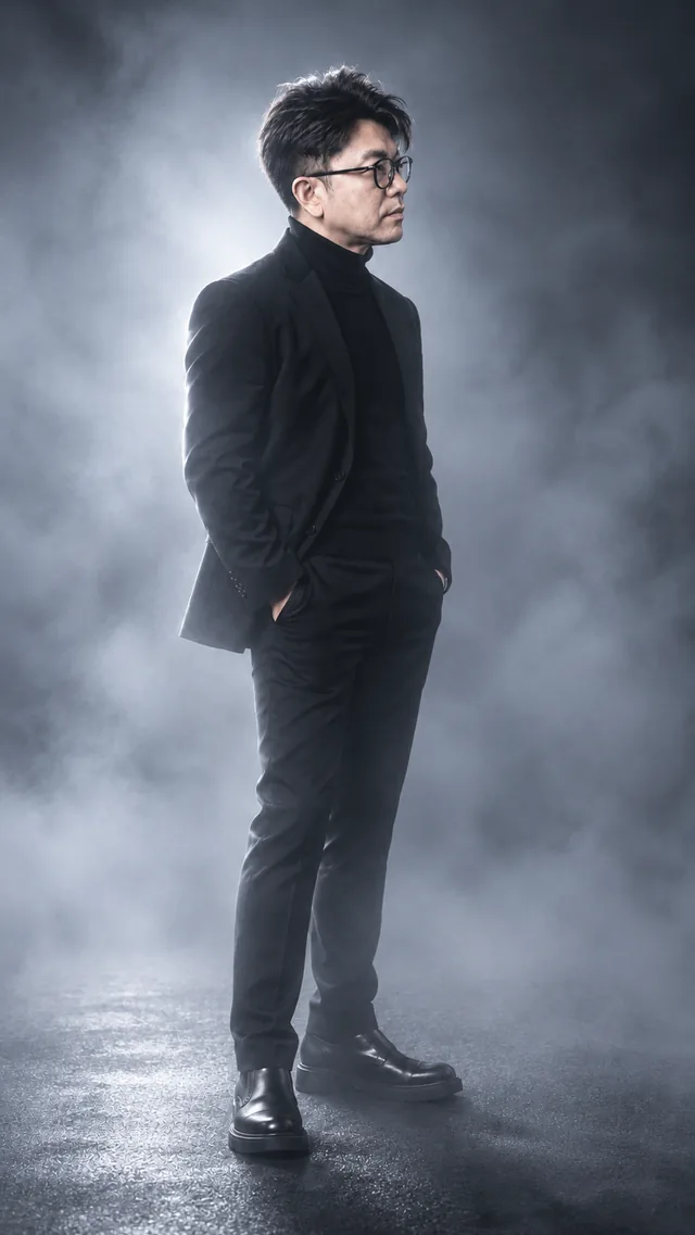 Fog Light: the same man in a black suit, showing quiet · diffused · mysterious light.